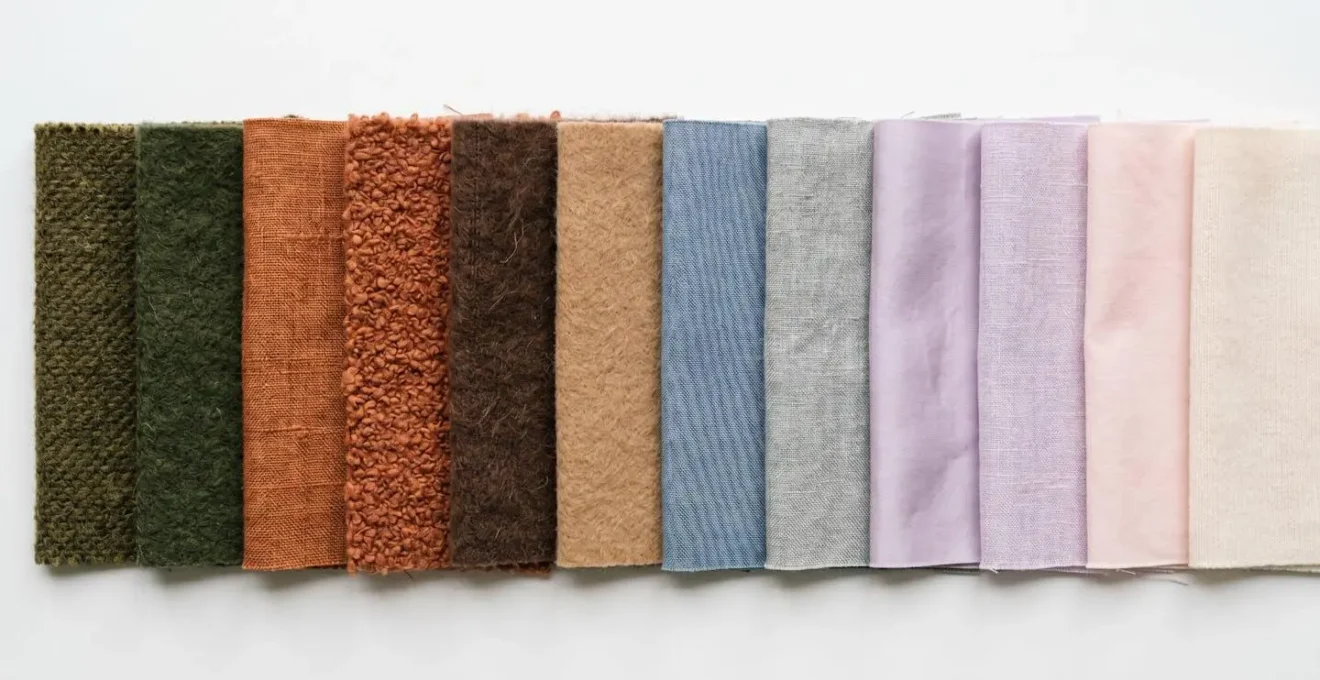 Color fabric swatches arranged showing earth tones versus pastels for pale skin styling