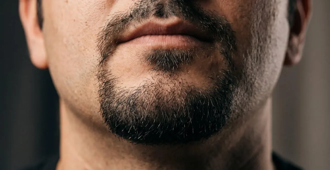 Close-up demonstration of goatee shaping technique showing clean-shaven cheeks creating jawline definition