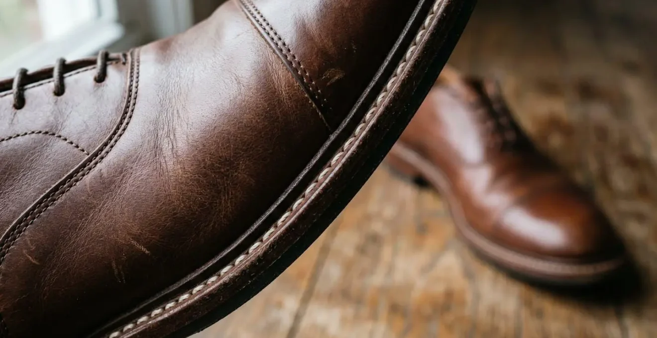 Detailed view of professional leather oxford shoe construction showing quality Goodyear welt craftsmanship