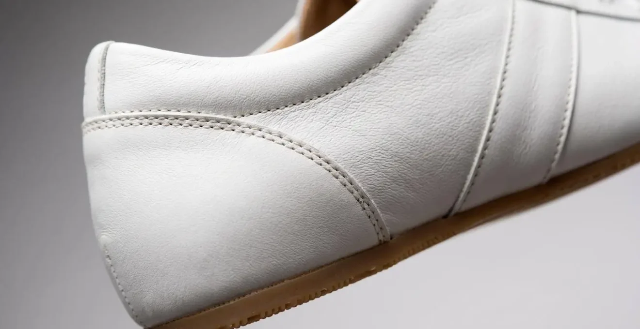 Close-up of minimalist leather sneakers with clean lines suitable for various occasions