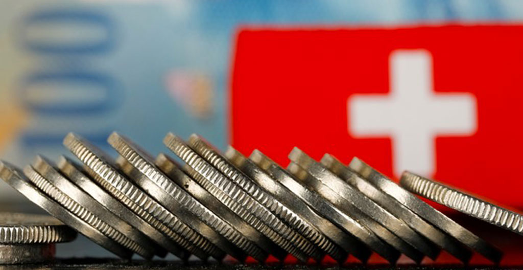 Swiss payroll calculation worksheet showing AHV/IV/EO and BVG contribution percentages and CHF amounts